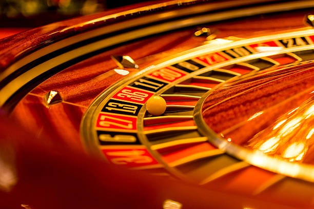 Live dealer rolling three dice in HD studio setting with multiple camera angles